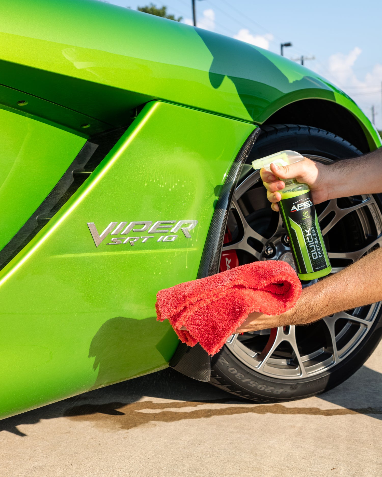 APEX Auto Products Quick Detailer being sprayed on green Dodge Viper with microfiber